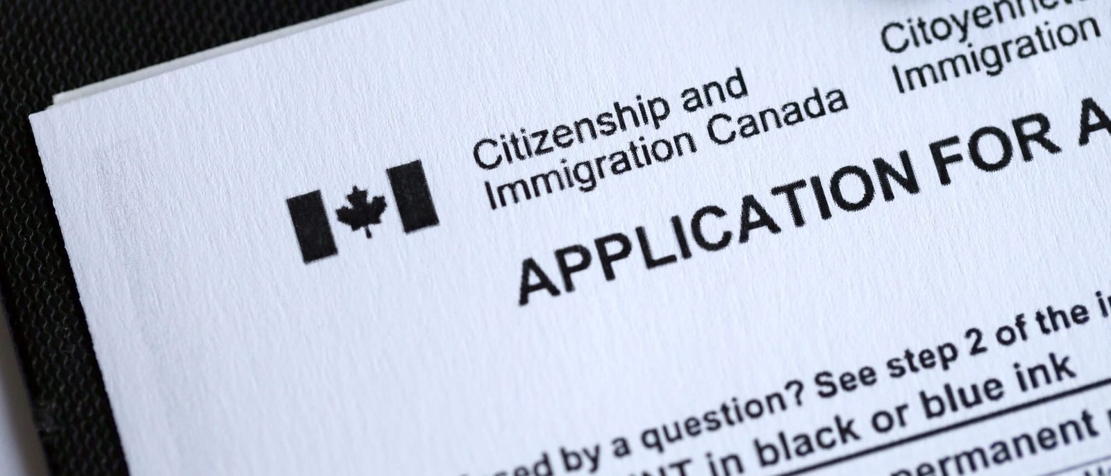 Citizenship and Immigration Canada inscription and small canadian flag Citizenship and Immigration Canada inscription and small canadian flag
