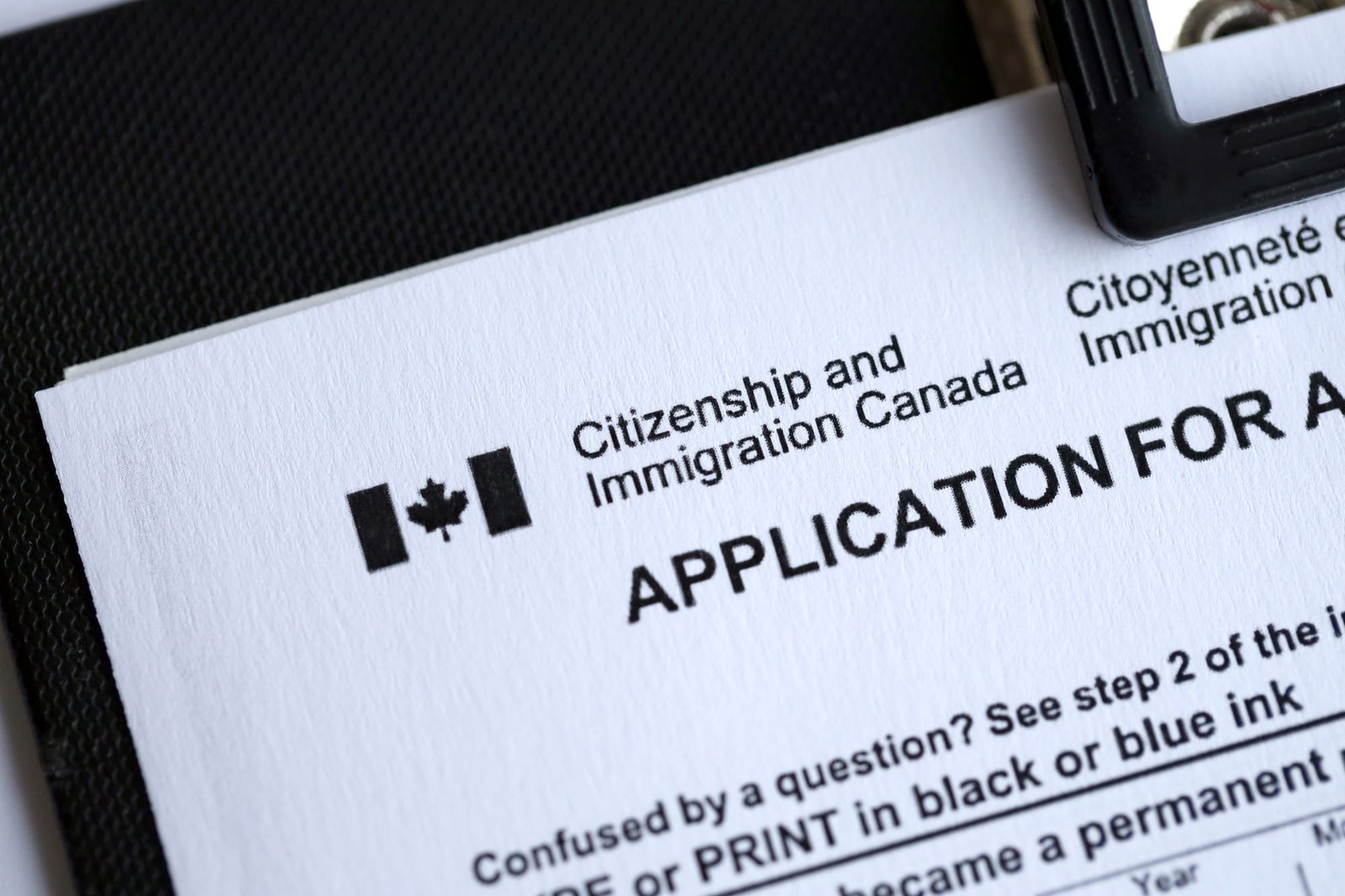 Citizenship and Immigration Canada inscription and small canadian flag