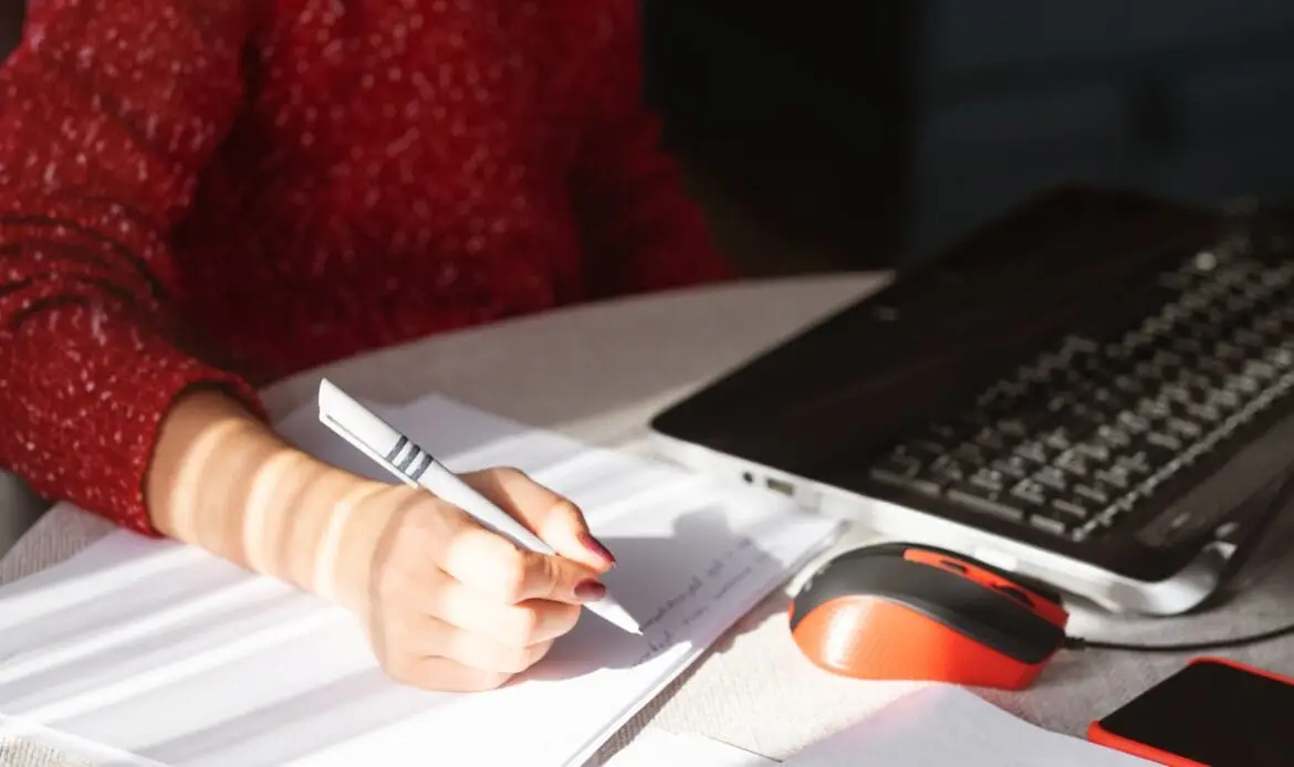 Immigration profile submission concept – person filling out forms for Canada Express Entry